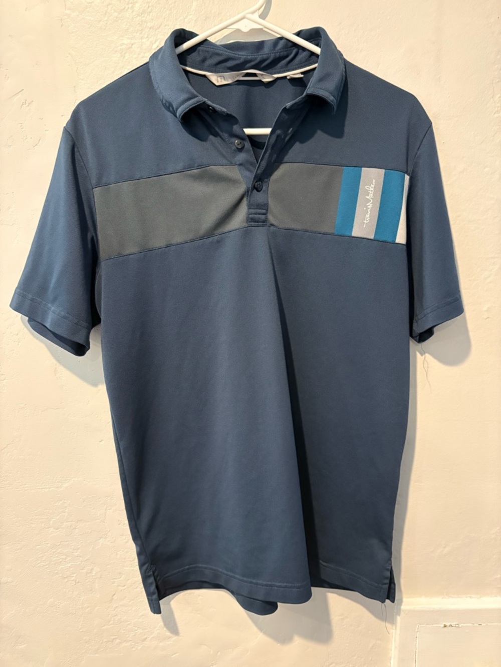 Travis Mathew Navy Polo with Contrast Chest Panel and Stripe